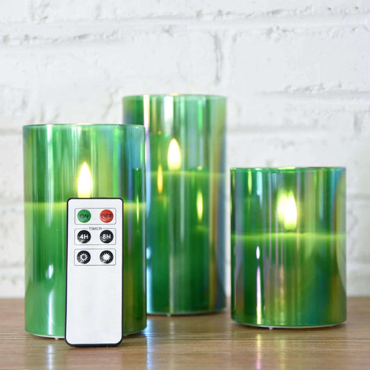 3 eywamage green glass flameless candles with a remote on the table