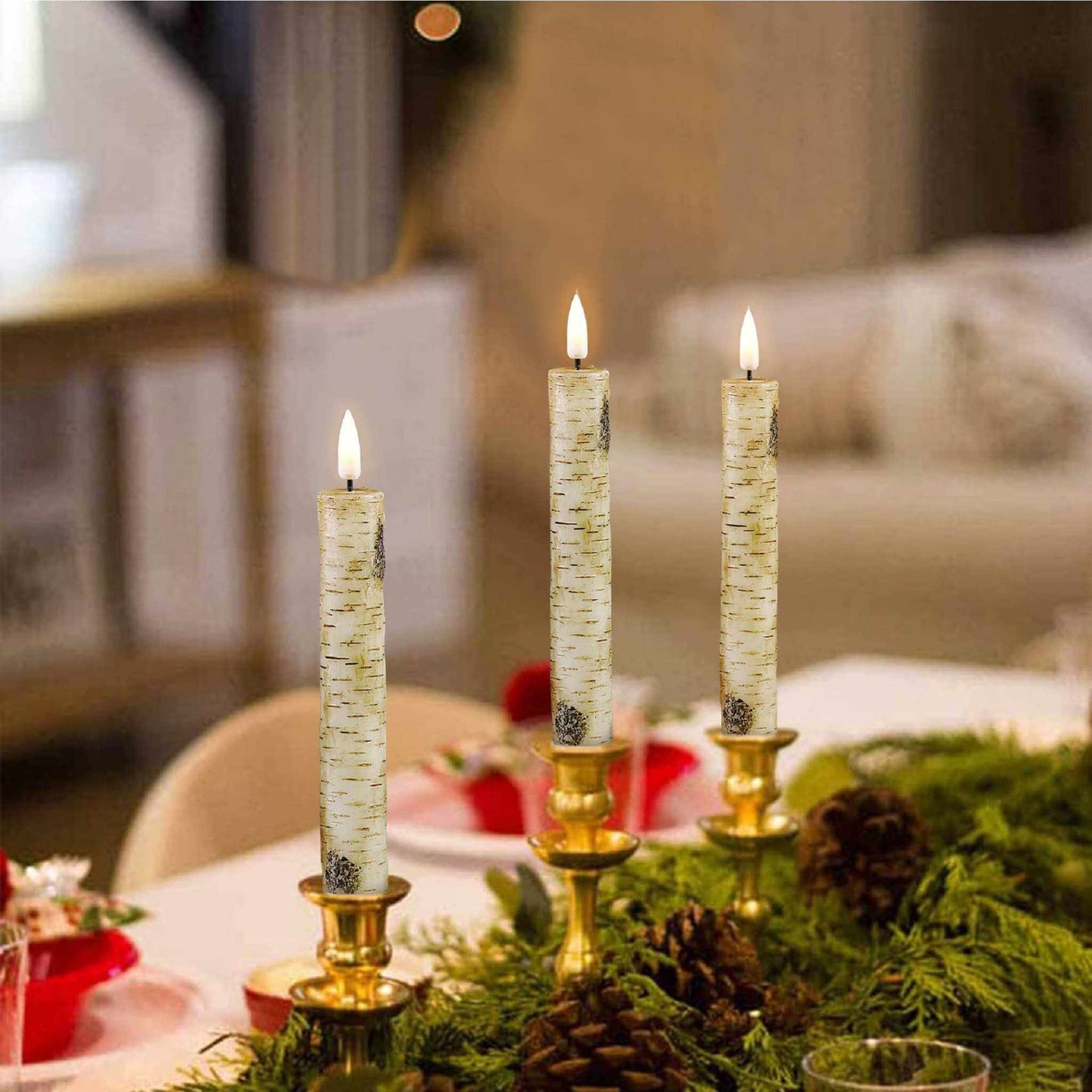 Scene of a romantic dinner table set with battery-operated taper candles and elegant place settings.