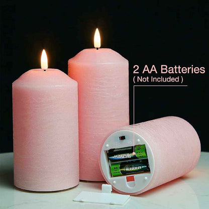 Three blush pin pillar flameless candels on the table, candles, one of which is placed horizontally with the bottom open, showing the need for two AA batteries